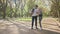 Young muslim couple in sport clothes using modern smartphone for taking selfie after outdoors activity. Man holding