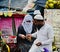 Young muslim lady is paying the ricksha fare to a man unique photo