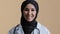 Young muslim professional woman female doctor physician in hijab white medical uniform consulting remote patient