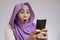 Young Muslim Woman Get Good News on Her Phone