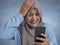 Young Muslim Woman Shocked Expression, Looking at Her Phone