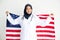 Young Muslim women exchange Students scholarship wear holding america flag over white background concept for hijab girl Islam.