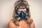 Young naked woman with gas mask - retro style