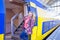 Young native dutch woman getting on a train in Amsterdam