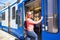 Young native dutch woman getting on the tram in Amsterdam Netherlands