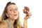 Young naughty woman eating chocolate donut happy guilty for unhealthy nutrition