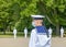 A young navy sailor in a medical mask stands in service during a rehearsal of the naval parade