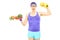 Young nerdy guy holding plate with vegetables and a dumbbell