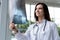 Young nice woman doctor watching a patient x-ray in hospital.