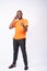 Young Nigerian man making a phone call and thumbs up isolated on a white background
