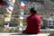 Young Novice Monk Sitting Outside Buddhist Temple