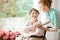 Young nurse helping an elderly woman in a wheelchair. Nursing ho