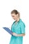 Young nurse with stethoscope writing at clipboard