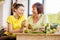 Young and older women with healthy food indoors