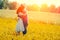 Young ouple hugging in the meadow