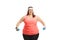 Young overweight woman exercising with dumbbells