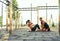 Young pair of athletes training abs on sport playground