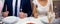 Young pair, bride and bridegroom, husband and wife during wedding, waiting for their meal.