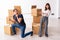 Young pair and many boxes in divorce settlement concept