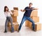 Young pair and many boxes in divorce settlement concept