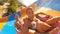 Young pair sliding down at water slide in aquapark. Couple having amusement and fun during resting on resort. Man and