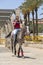 Young Palestinian Arab boy riding a horse outside the old city walls in Jerusalem