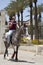 Young Palestinian Arab boy riding a horse outside the old city walls in Jerusalem