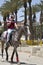 Young Palestinian Arab boy riding a horse outside the old city walls in Jerusalem