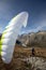 Young paraglider pilot uses his paraglider to play with the wind in the Swiss Alps, the so-called ground handling
