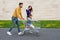 Young parent pushes her daughter in the shopping cart