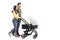 Young parents pushing a baby stroller