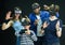 Young parents with teenage sons having fun with vr headset goggles