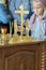 A young parishioner lights a candle at the altar in the church