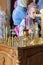 A young parishioner lights a candle at the altar in the church