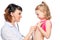 Young pediatrician listens preschooler girl isolated