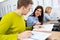 Young people attending driving education in a classroom sitting at their desks