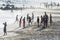 Young people on the beach playing sand soccer in the middle of the coronavirus pandemic