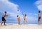 Young people on the beach playing volleyball