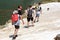 Young People in the Beautiful view hiking in the Andorra Pyrenees Mountains in Ordino, near the Lakes of Tristaina