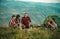 Young people on camping trip. Company of young active friends of boys and girls hiking in mountain countryside.