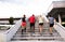 Young people in the city running up the stairs.