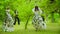 Young people in costume walks on stilts at the park