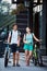 Young people, couple with bicycles on the street