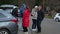 Young people dancing around themself outdoors.