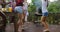 Young People Dancing While Cooking Barbecue Frineds Group Gathering On Summer Terrace Having Party Legs Closeup View