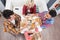 Young people drink coffee shop, friends sitting table smiling