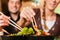 Young people eating in Thai restaurant