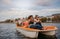 Young people enjoying boat ride in the lake