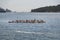 Young people are floating in a sea kayaks. Water-based activities in Dubrovnik Bay. Sea kayaking