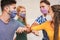 Young people friends bump their elbows instead of greeting with a hug - Avoid the spread of coronavirus, social distance and